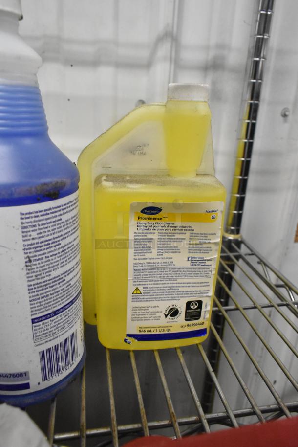 Auction lot featuring Diversey Prominence Floor Cleaner and Betco Spectaculoso Cleaner, placed on metal shelves.