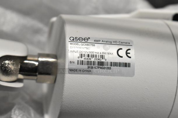 Q-See 4MP Analog HD Camera, Model QCA8075B, NTSC system, input DC12V/500mA 4.6W max, made in China.