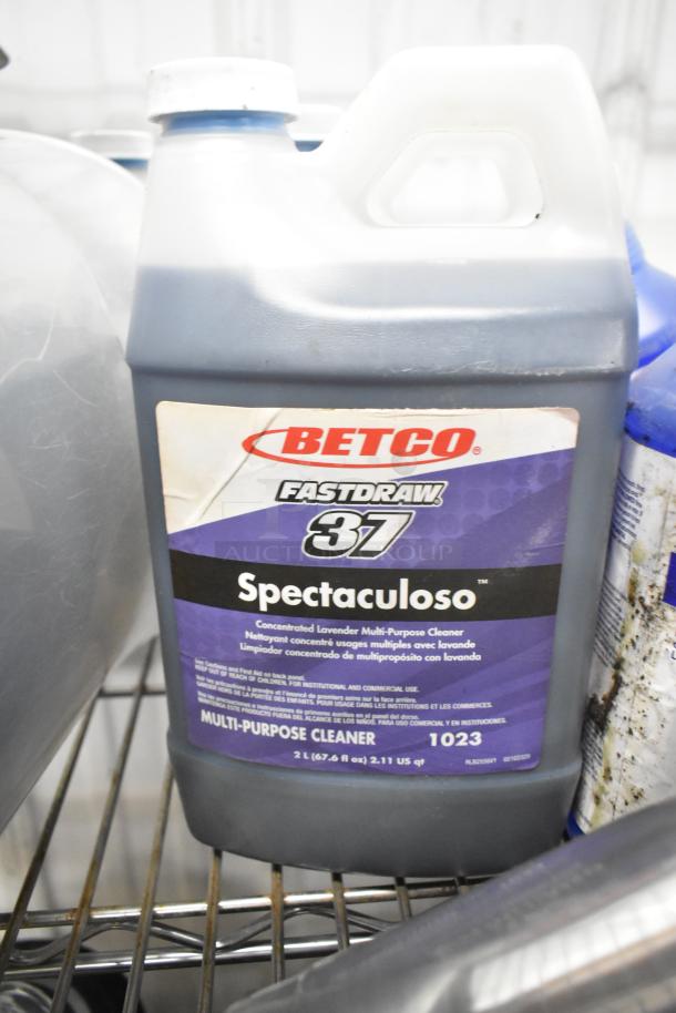 Betco Spectaculoso lavender multi-purpose cleaner, 2L bottle, part of auction bundle. Gently used condition, visible label.