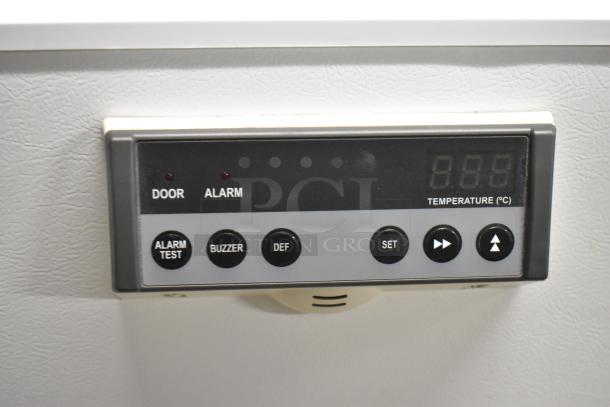 PHCbi SR-L6111W cooler control panel, showing digital display with buttons for alarm test, buzzer, and temperature settings.