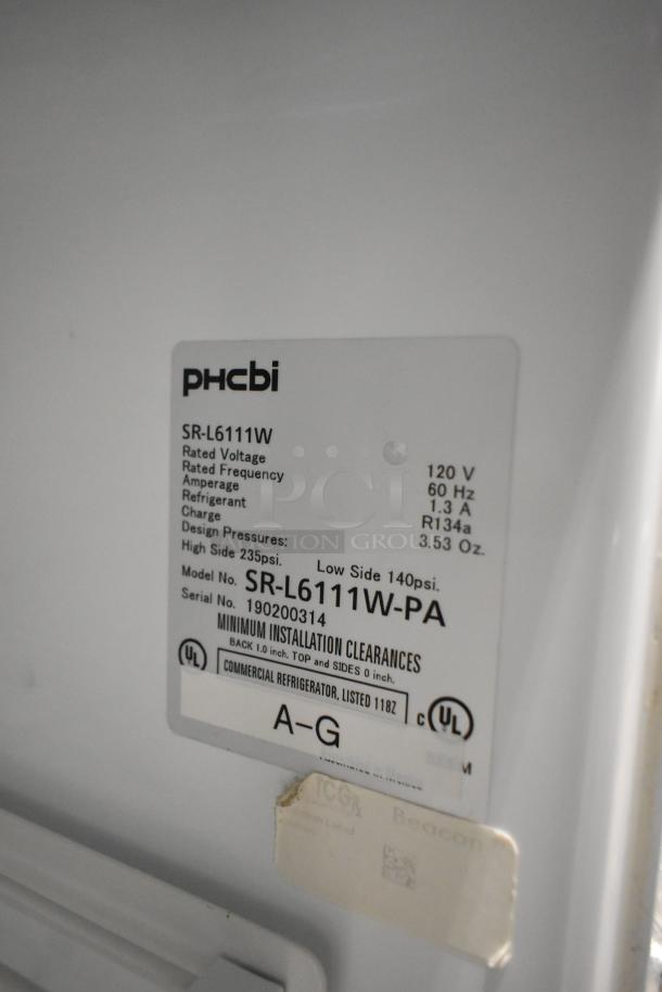 PHCbi SR-L6111W commercial cooler label showing model, voltage, and refrigerant details. Stainless steel, undercounter design.