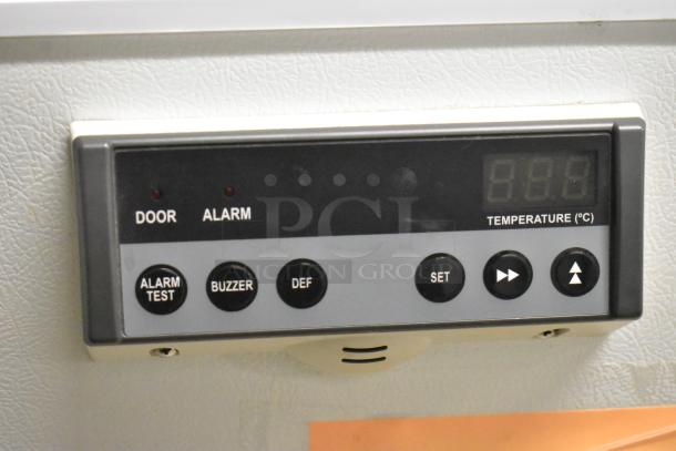 PHCbi SF-L6111W stainless steel undercounter freezer control panel, showing door/alarm lights and temperature settings.