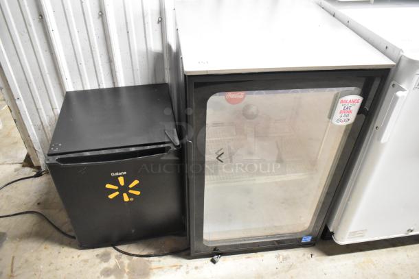 Imbera EVD04 and Galanz GL17BK mini coolers. Imbera has glass door with decals; Galanz is black. Both 115V, 1 phase.