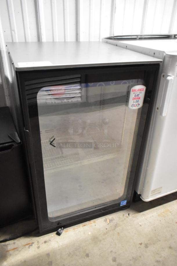 Imbera EVD04 mini cooler merchandiser with glass door. Good condition, 115 volts. "Balance What You Eat, Drink & Do" sticker visible.