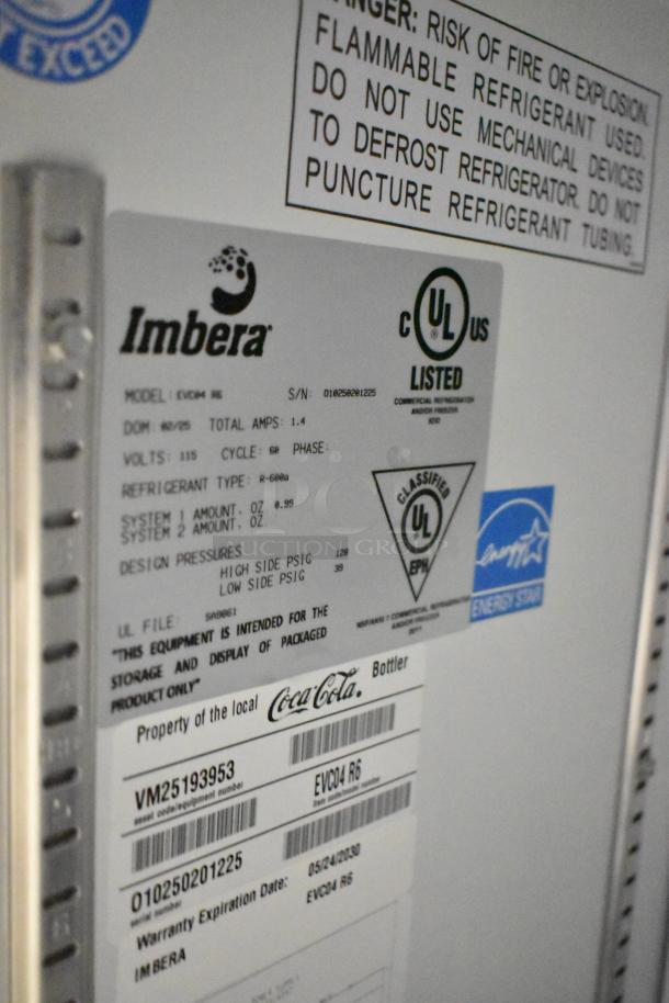 Imbera EVD04 mini cooler label showing model, 115 volts, UL listed, refrigerant type, and Coca-Cola branding.