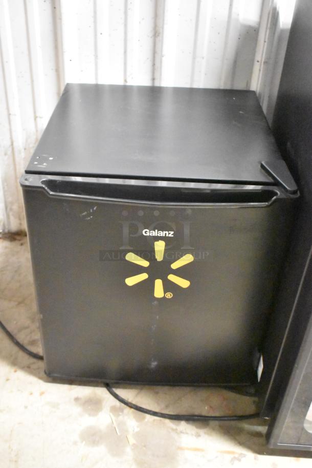 Galanz GL17BK mini cooler, black, 115 volts. Slight wear. Front logo visible. Auction includes Imbera EVD04 cooler.