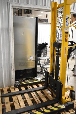 Brand new Vestil VHPS-2000-AA metal manual stacker with 2,000 lb capacity, adjustable legs and forks, minor scratches.