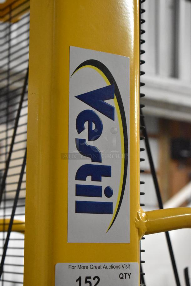 Brand new Vestil VHPS-2000-AA manual stacker, 2,000 lb capacity, adjustable legs/forks, minor scratches and dents visible.