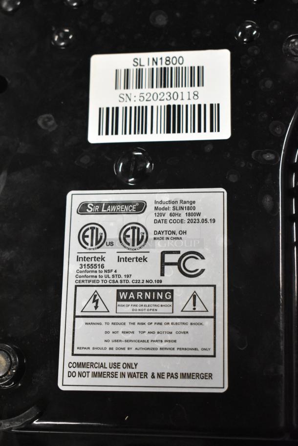 2023 Sir Lawrence SLIN1800 induction range label; shows model, serial number, 120V 1800W, ETL, FCC certifications, warnings.