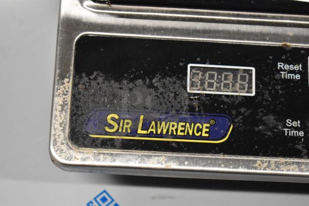 2023 Sir Lawrence SLIN1800 induction range, stainless steel, with a crack in the glass top. Visible brand logo and digital display.