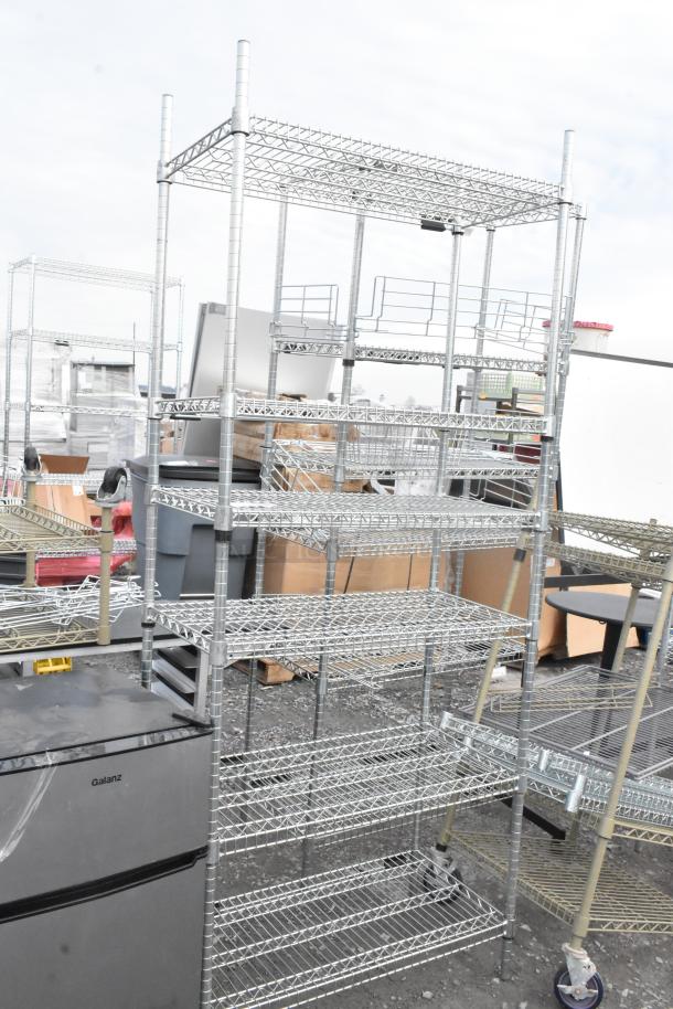 Two metal wire shelving units, multi-tiered, excellent condition. Buyer dismantles. Consider freight charges.