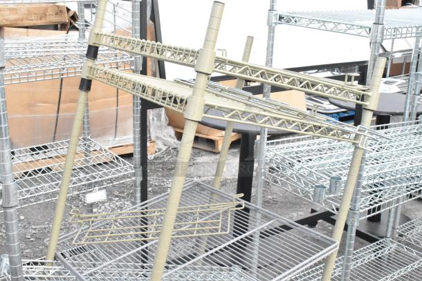 Two wire shelving units in used condition, various sizes, featuring metal frames and wire mesh shelves. Disassembly required.