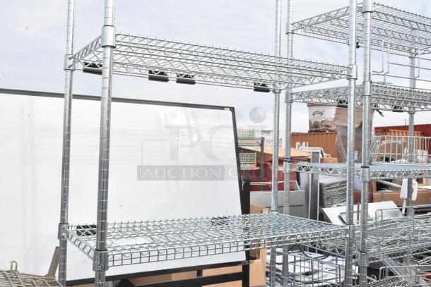 Two chrome wire shelving units, sturdy construction, multiple adjustable shelves, buyer must dismantle.