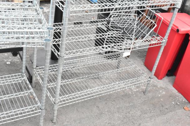 Chrome finish wire shelving units featuring multiple tiers and durable construction. Buyer must dismantle.