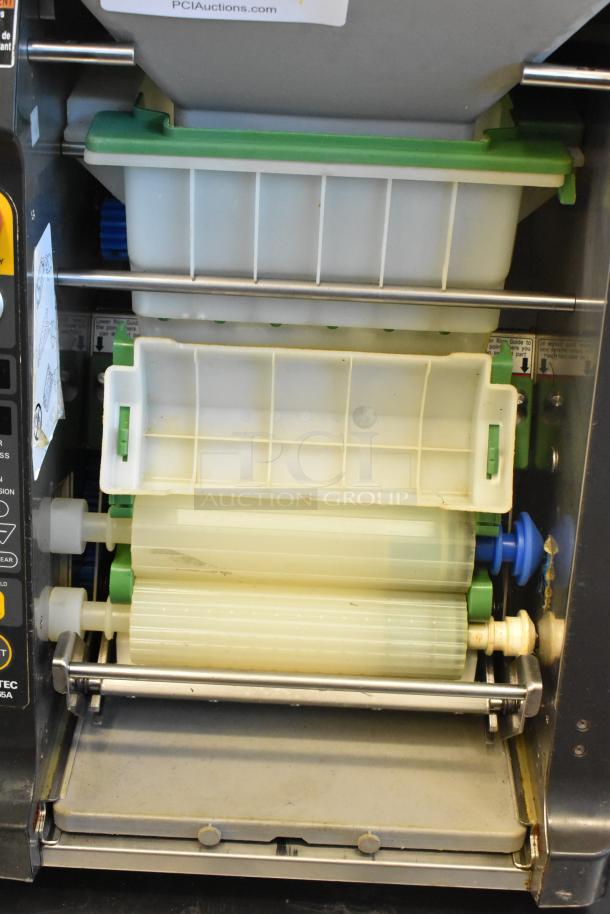 Autec ASM865A Sushi Maker, stainless steel, countertop model, 120V, commercial use. Serial numbers on tags indicate specifications.