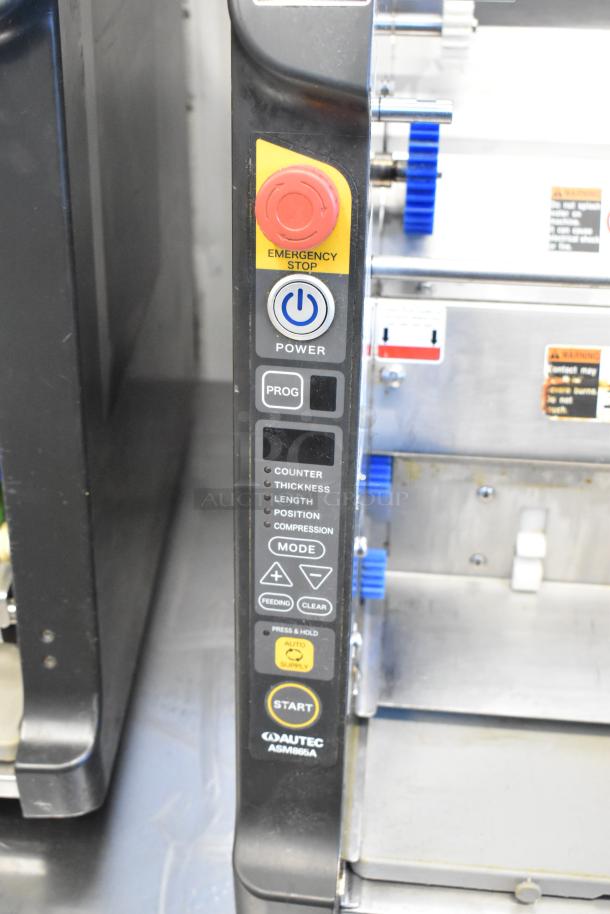 Autec Audio-Technica ASM865A stainless steel sushi maker with control panel showing emergency stop, power, and mode settings.