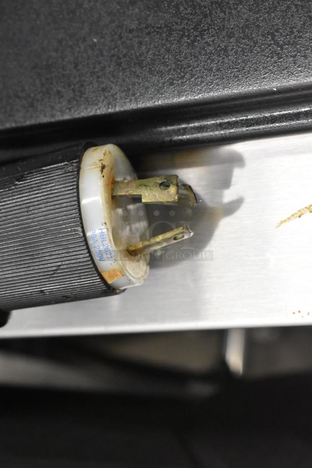 Autec Audio-Technica ASM780A sushi machine power plug, shows wear. HBL2621, 30A, 250V marking visible.
