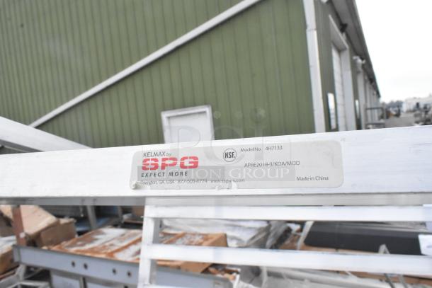 Metal Commercial Pan Transport Rack, model 4H7133 by SPG, on casters, label shows NSF certification, made in China.