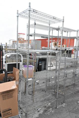 Chrome finish 4-tier shelving unit, in good condition. Buyer must dismantle. Consider freight charges.