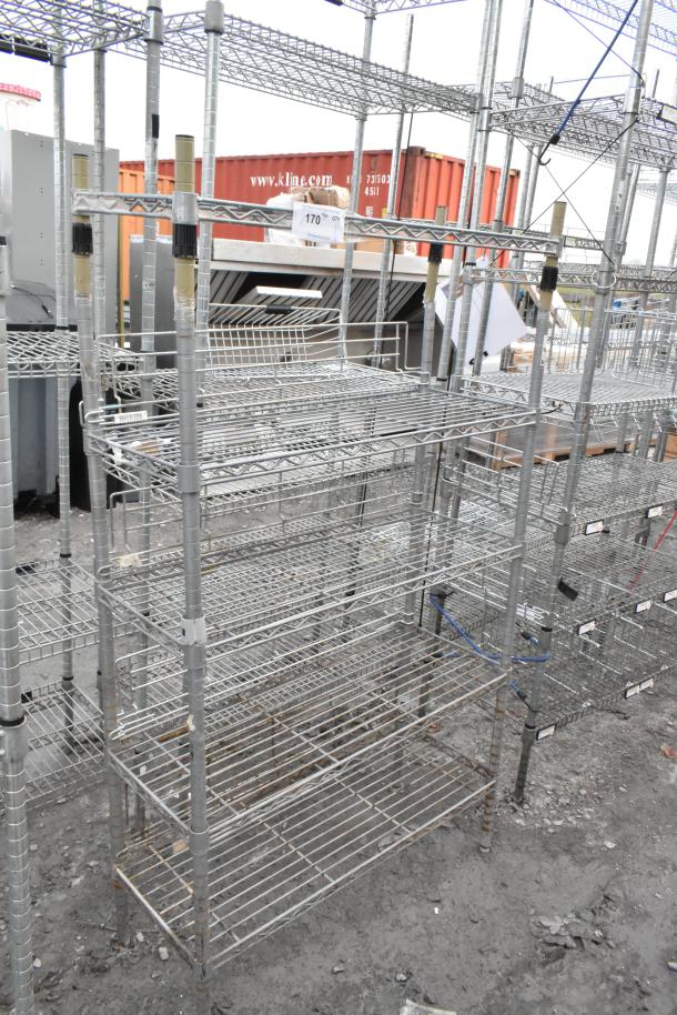 Chrome finish 5 tier shelving unit, sturdy wire construction, some signs of wear. Buyer must dismantle. Consider freight charges.