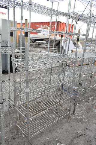 Chrome finish 5 tier shelving unit, sturdy wire construction, some signs of wear. Buyer must dismantle. Consider freight charges.