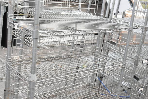 Chrome Finish 5 Tier Shelving Unit, wire design, sturdy, made in China, buyer must dismantle, freight charges apply.