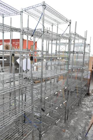 Chrome finish 7-tier shelving unit outdoors, wire construction, buyer must dismantle, freight charges apply.