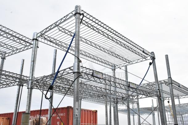 Chrome finish 7-tier shelving unit, industrial style, robust construction, buyer must dismantle, freight charges apply.