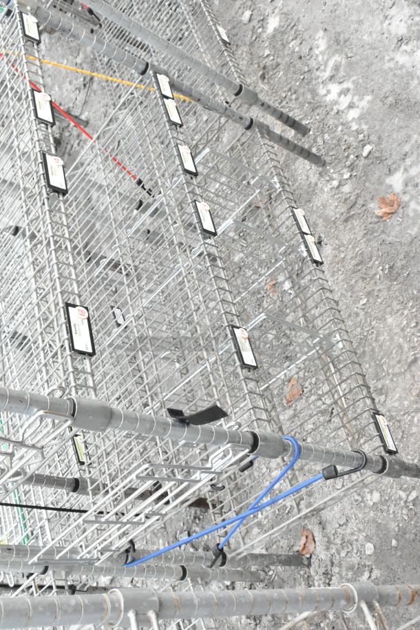 Chrome finish 7-tier shelving unit with wire construction, featuring visible labels. Buyer must dismantle for shipping.