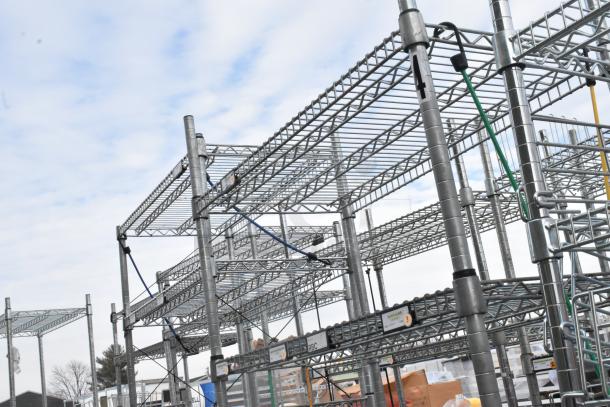 Chrome finish 5-tier shelving unit, sturdy metal frame, good condition, visible labels, buyer must dismantle.