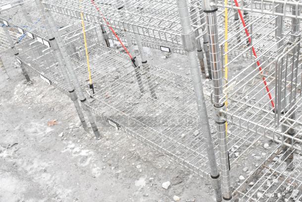 Chrome finish 5-tier shelving unit, sturdy wire construction, industrial style, dismantling required, freight charges apply.