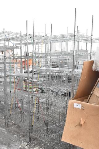 Chrome finish 6-tier shelving unit, assembled, featuring sturdy wire shelves. Buyer must dismantle. Consider freight costs.