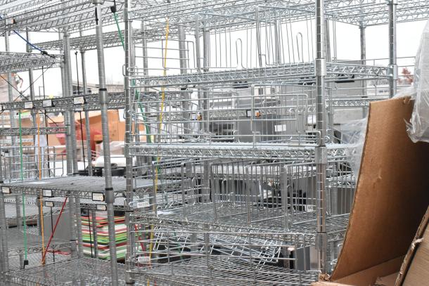 Chrome finish 6-tier shelving unit, industrial style, sturdy wire construction. Buyer must dismantle; freight charges apply.