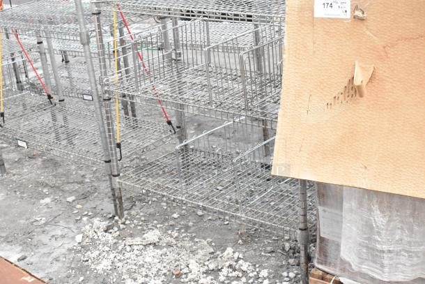 Chrome finish 6-tier shelving unit, used condition. Wire shelves with adjustable design. Buyer's dismantling required.