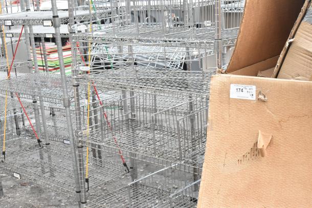 Chrome finish 6-tier shelving unit with wire shelves, visible in dismantled state. Buyer must dismantle for shipping.