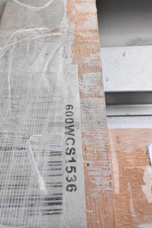 Brand new Regency 600WCS1536 stainless steel wall cabinet, 36" with sliding doors, scratch and dent condition, visible label.