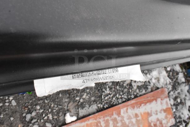 7 new scratch and dent black poly tilt trucks, code 4754GU153TBK, visible wear on exterior.