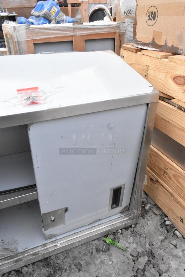 Brand new Regency 600WCS1536 stainless steel wall cabinet, 36", with sliding doors. Missing one door. Scratch and dent condition.