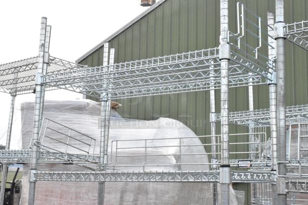 Two chrome finish wire shelving units, assembled outdoors. Ideal for storage, buyer must dismantle. Consider freight.