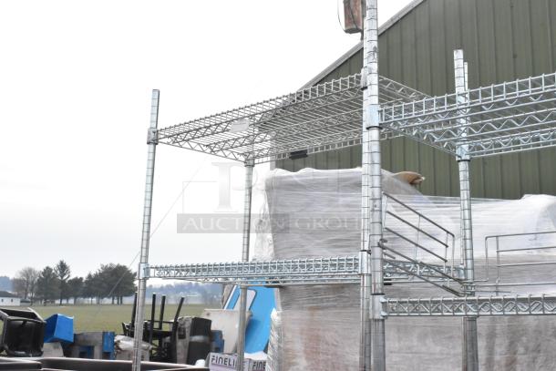 Two chrome finish wire shelving units in good condition, outdoor setting. Buyer must dismantle. Consider freight charges.