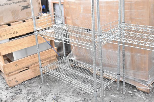 Two chrome finish wire shelving units in good condition, featuring adjustable shelves. Buyer must dismantle.