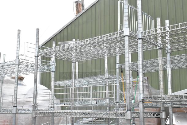 Two chrome finish wire shelving units, sturdy design, ideal for storage. Buyer must dismantle; freight charges apply.