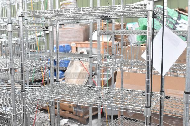 Two chrome finish wire shelving units in good condition, suitable for storage. Buyer must dismantle for shipping.
