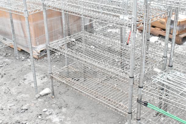 Two chrome finish wire shelving units; durable metal, multi-tiered, requires dismantling; buyer responsible for freight.