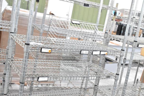 Two chrome finish wire shelving units, featuring adjustable shelves and visible small labels. Buyer must dismantle.
