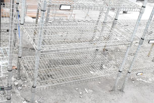 Two chrome finish wire shelving units, sturdy design, dismantling required, visible labels for organization.