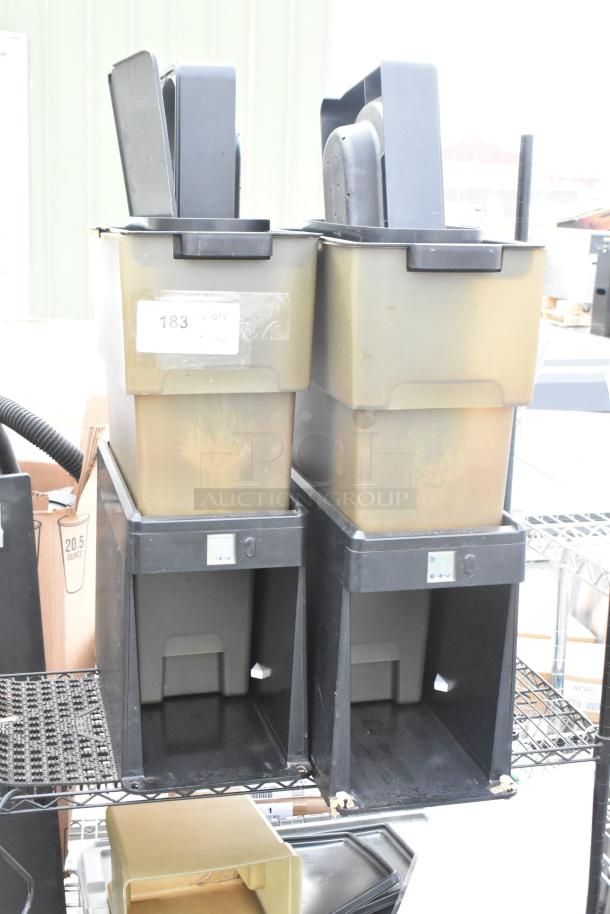 Black and tan two-tier wire shelving unit with beverage dispensers; condition fair, requires dismantling for collection.