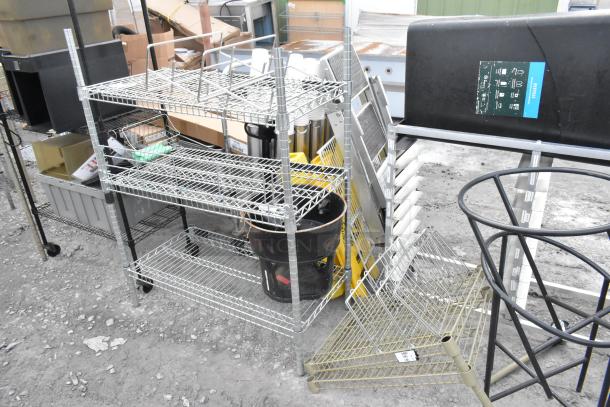 Two wire shelving units; one missing three poles. Buyer must dismantle. Consider freight charges.