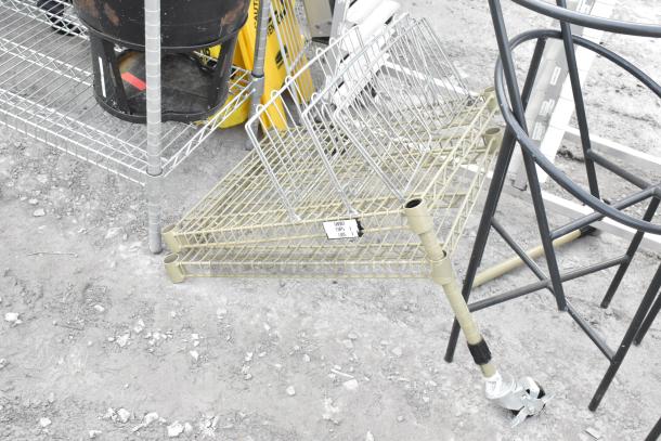 Two wire shelving units, one missing three poles. Includes additional items and labels. Buyer to dismantle.