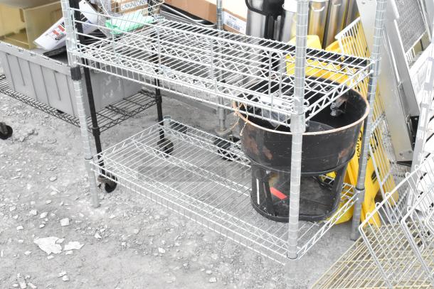 Two wire shelving units, metal construction, one missing three poles. Buyer must dismantle. Consider freight costs.